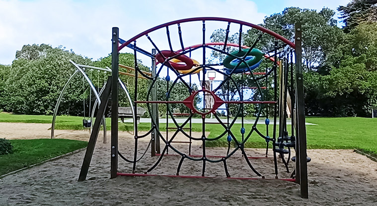 Surfdale Hall Reserve and Foreshore - Climbing nets with a swing set and basketball half-court in the background. Photo credit: K Sumner.