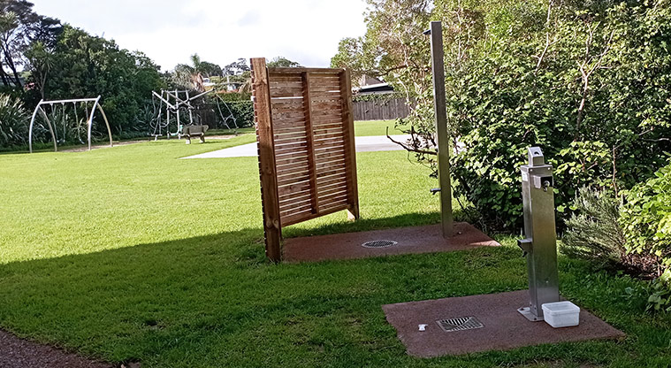 Surfdale Hall Reserve and Foreshore - Drinking fountain and beach shower with the playground in the background. Photo credit: K Sumner.