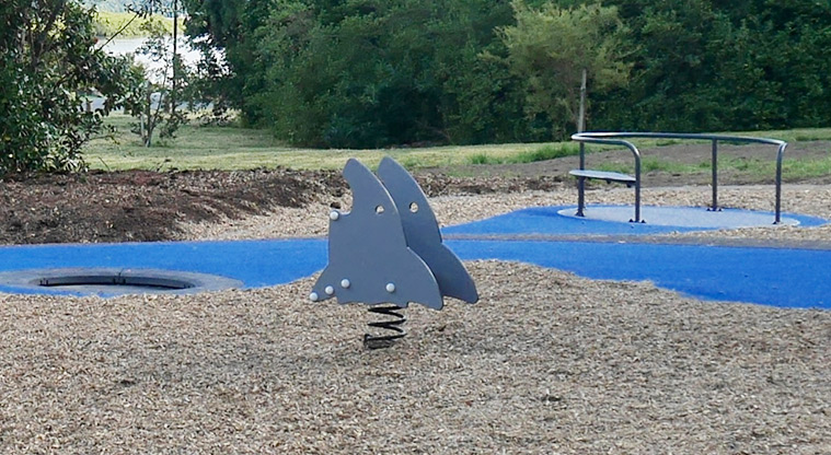 Taipari Strand - Shark rocker toy, in-ground trampoline and carousel.
