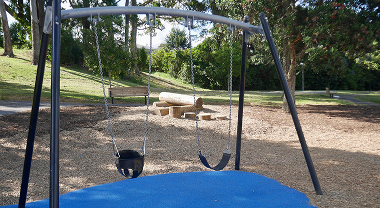 Taipari Strand - Set of two swings with the balance poles and a seat in the background.