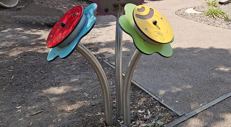 Takapuna Beach Reserve - Brightly coloured interactive sensory flowers.