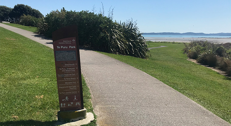 Te Puru Park - Path around the park and directional sign pointing to areas of interest.