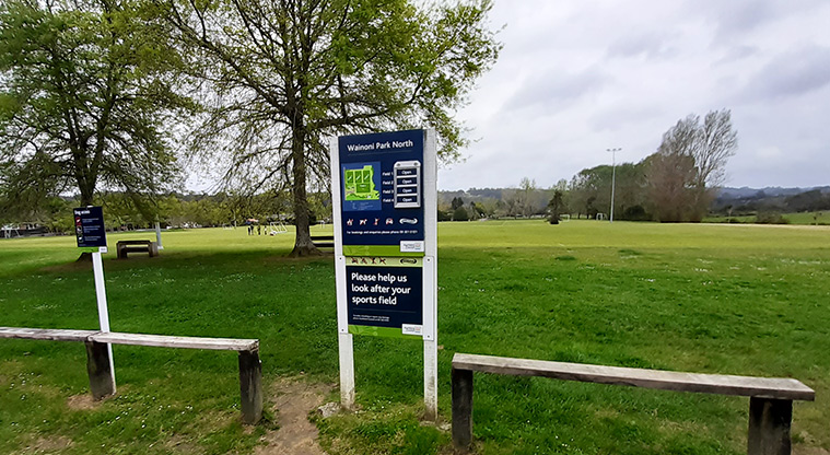 Wainoni Park North - Park sign with sports fields in the background.