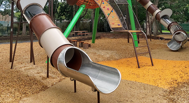 Western Springs Lakeside - Bottom section of the large slide showing a viewing window and the ladder for climbing up the slides.