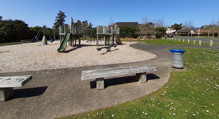 Xena Park - Seating area and playground in the background. Photo credit: Tracey Hodder.
