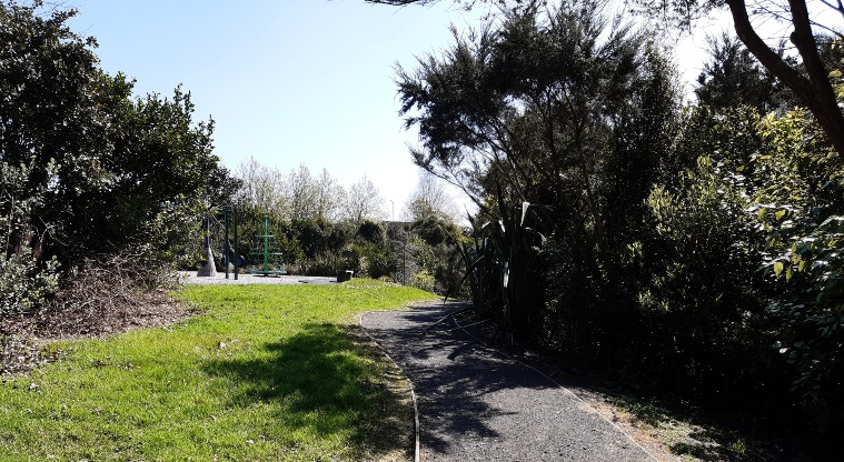 Xena Park - Open grassed area with walkway and trees. Photo credit: Tracey Hodder.