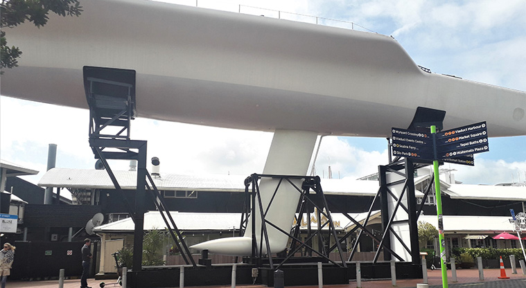 Coast to Coast Path (City to Pukekawa / Auckland Domain) – Start of the path on Te Wero Bridge, next to the KZ1 Team New Zealand America's Cup Yacht.