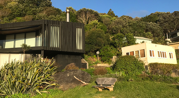 Onetangi Beach Path - Beach houses old and new line the waterfront.